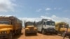 Aid trucks trickle into Darfur as army pauses delivery ban