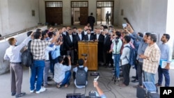 FILE - A lawyer for Jamaat-e-Islami speaks after a Bangladesh court dismissed a bid to flip the cancellation of the party's registration with the Election Commission, in Dhaka, Nov. 19, 2023. Bangladesh's government on Aug. 28, 2024, overturned a ban on the party.