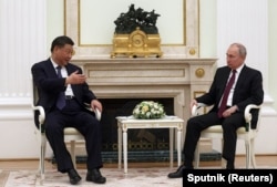 俄罗斯总统普京在莫斯科克里姆林宫会见到访的中国领导人习近平。（2023年3月20日）