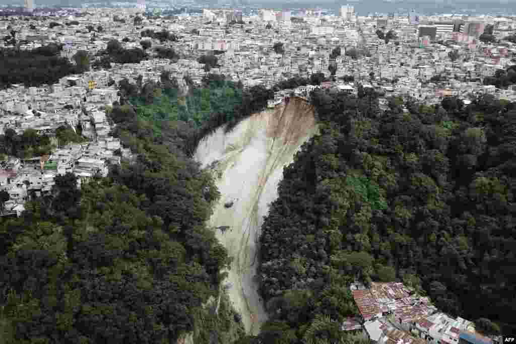 Handout picture released by Guatemala&#39;s Volunteer Firefighters shows an aerial view of the landslide in Las Calaveras neighborhood in Guatemala City, Nov. 22, 2023.