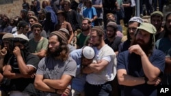 Mourners attend the funeral of Nachman Mordoff, 17, in the West Bank Israeli settlement of Shilo, June 21, 2023.