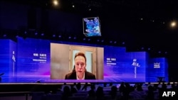 FILE - Tesla CEO Elon Musk speaks via video link at the opening ceremony of the World Artificial Intelligence Conference in Shanghai on July 6, 2023. 