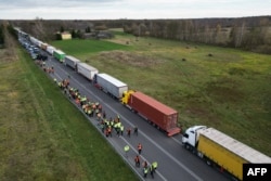 FILE - Trucks line up near the Polish-Ukrainian border crossing in Dorohusk, Poland, on Nov. 10, 2023. Polish trucking representatives said on Nov. 13, 2023, that talks with Ukrainian officials had failed to end a dispute over what they call unfair competition.