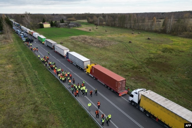 FILE - Trucks line up near the Polish-Ukrainian border crossing in Dorohusk, Poland, on Nov. 10, 2023. Polish trucking representatives said on Nov. 13, 2023, that talks with Ukrainian officials had failed to end a dispute over what they call unfair competition.
