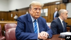 FILE - Former President Donald Trump awaits the start of proceedings in Manhattan criminal court in New York, April 16, 2024.