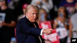 Republican presidential candidate former President Donald Trump gestures during a campaign rally in Harrisburg, Pennsylvania, July 31, 2024. A New York appeals court on Aug. 1 denied Trump's bid to end a gag order in his hush money criminal case.