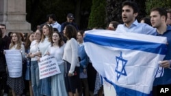 Pro-Israel demonstrators sing a song during a protest at Columbia University, Oct. 12, 2023, in New York.