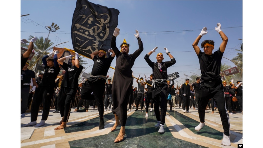 Shiite pilgrims mark the holiday of Arbaeen in Karbala, Iraq, Aug. 24, 2024. The holiday marks the end of the 40-day mourning period after the anniversary of the martyrdom of Imam Hussein in the 7th century.