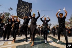 Shiite pilgrims mark the holiday of Arbaeen in Karbala, Iraq, Aug. 24, 2024. The holiday marks the end of the 40-day mourning period after the anniversary of the martyrdom of Imam Hussein in the 7th century.