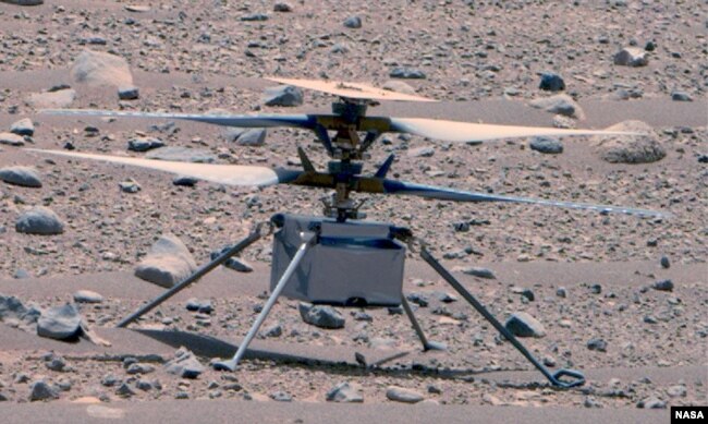 This enhanced color image of NASA's Ingenuity Mars Helicopter was taken by the This enhanced color image of NASA's Ingenuity helicopter was taken by the Mastcam-Z instrument aboard Perseverance on April 16, 2023. (NASA/JPL-Caltech/ASU/MSSS)