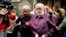 FILE — Romanian guru Gregorian Bivolaru is escorted to a vehicle after a hearing at the Romanian Police headquarters in Bucharest, Romania, Aug. 24, 2016. 