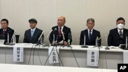 Shimon Ishimaru, center, who represents the victims' group, speaks to reporters about the alleged abuse of boys by Japanese entertainment mogul Johnny Kitagawa, during a news conference in Tokyo, Jan. 15, 2024. 