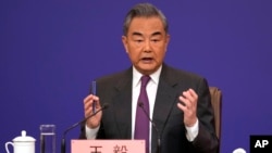 FILE - Chinese Foreign Minister Wang Yi speaks during a press conference in Beijing, March 7, 2024. 