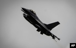 FILE - A Ukrainian Air Force F-16 fighter jet flies in an undisclosed location in Ukraine, Aug. 4, 2024.