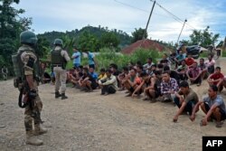 Police detain alleged suspects of the viral sexual assault video in Pechi Awang Leikai village of the Thoubal district of north eastern state of Manipur, India, July 22. 2023.