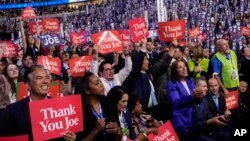 Delegates cheer as President Joe Biden speaks during the first day of Democratic National Convention, Aug. 19, 2024, in Chicago.