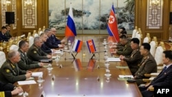 This handout picture taken July 26, 2023, and released by the Russian Defense Ministry shows Russian Defense Minister Sergei Shoigu meeting his North Korean counterpart, Kang Sun Nam, in Pyongyang.