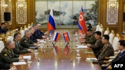 This handout picture taken July 26, 2023, and released by the Russian Defense Ministry shows Russian Defense Minister Sergei Shoigu meeting his North Korean counterpart, Kang Sun Nam, in Pyongyang.