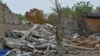 FILE - A police officer searches for parts of a missile at a site of a building damaged by a Russian strike, in Zaporizhzhia, Sept. 3, 2024. The Russian Defense Ministry said Monday that its forces had “liberated” the village of Levadne and occupied better positions in the area.