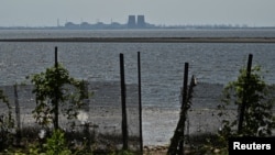 A view shows Zaporizhzhia Nuclear Power Plant from the bank of Kakhovka Reservoir near the town of Nikopol after the Kakhovka dam breached, amid Russia's attack on Ukraine, in Dnipropetrovsk region, Ukraine.