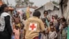 FILE - Red Cross officials create awareness of mpox in the Don Bosco refugee camp in Goma, Democratic Republic of the Congo, Aug. 22, 2023.