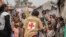 FILE - Red Cross officials create awareness of mpox in the Don Bosco refugee camp in Goma, Democratic Republic of the Congo, Aug. 22, 2023.