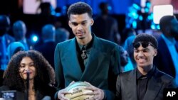 Victor Wembanyama reacts during introductions before the NBA basketball draft, Thursday, June 22, 2023, in New York. 