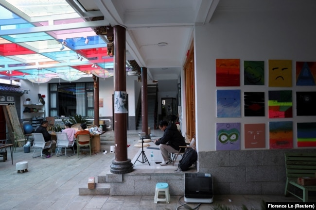 People work at a co-working hub for digital nomads in Dali, Yunnan province, China November 10, 2023. (REUTERS/Florence Lo)