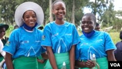 Three Zimbabwean school children enjoy some free time in Harare, Jan. 16, 2024. Some girls in Zimbabwe had to drop out of school after becoming pregnant. (Columbus Mavhunga/VOA)