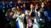 Supporters of the Progressive Slovakia party react to the first exit polls of the country's early parliamentary election in Bratislava, Slovakia, Sept. 30, 2023. 