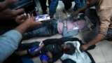 Palestinians wounded in the Israeli bombardment of the Gaza Strip are brought to the hospital in Deir al Balah, Dec. 5, 2023. 