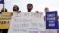 People in favor of canceling student debt protest outside the Supreme Court, June 30, 2023, in Washington. 