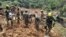 Colombian Army rescuers search for survivors of a landslide caused by heavy rains in Choco, Colombia, Jan. 13, 2024. (Colombian Army/Handout via Reuters)