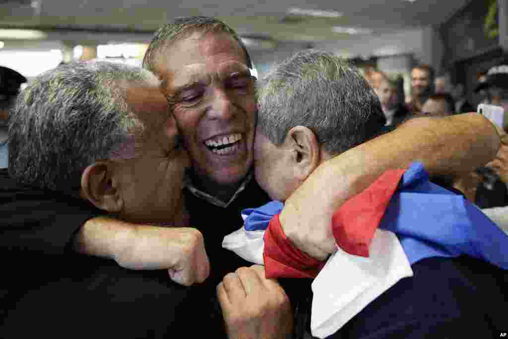 Juan Angel Napout, the former president of soccer&#39;s South American governing body, is welcomed by family and friends after landing at Silvio Pettirossi Airport in Luque, Paraguay. Napout was released from a federal prison in Miami and deported to Paraguay after serving 5 1/2 years.