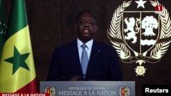 In a screengrab from video, Senagalese President Macky Sall is seen addressing the nation, as he announces that he will not seek a third term, in Dakar, Senegal, June 3, 2023. (Radio Television Senegalaise via Reuters)