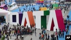 (FILE) Visitors walk past the giant word for "Data" during the Guiyang International Big Data Expo 2016 held in Guiyang in southwestern China.