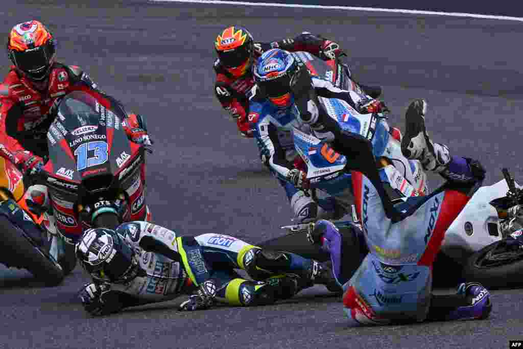 Riders crash during the Italian Moto2 Grand Prix race at Mugello Circuit in Mugello, Italy.