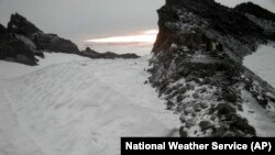 This photo from the National Weather Service shows a snow-covered section of Mt. Rainier, Washington, at 10,000 feet, Aug. 24, 2024.