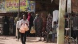 FILE: People line up in front of a bakery during a cease-fire in Khartoum, Sudan, on May 27, 2023, as the current cease-fire took effect. Authorities say the halt is largely holding in Khartoum. 