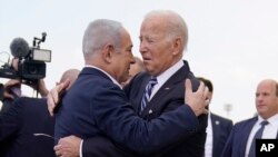 FILE - President Joe Biden is greeted by Israeli Prime Minister Benjamin Netanyahu after arriving at Ben Gurion International Airport, on Oct. 18, 2023, in Tel Aviv. 