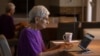 FILE - Barbara Winston uses a computer at her home in Northbrook, Ill., on June 30, 2024, several days after taking an introduction to artificial intelligence class at a local senior center.