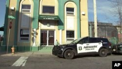 A Newark Police vehicle is parked outside the Masjid-Muhammad-Newark Mosque in Newark, New Jersey, Jan. 3, 2024. An imam was shot outside the mosque.