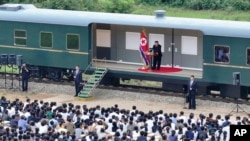 In this photo taken during a two-day trip on Aug. 8 and Aug. 9, 2024, and provided by the North Korean government, North Korean leader Kim Jong Un delivers a speech as he visits a flood-hit area in Uiju, North Phyongan province, North Korea.