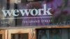 Logo WeWork di pintu masuk salah satu ruang kantor mereka di kawasan SoHo, New York, Selasa, 15 Oktober 2019. (AP/Mary Altaffer)