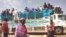 FILE - People board a truck as they leave Khartoum, Sudan, on June 19, 2023. The United Nations Security Council adopted a resolution on March 8, 2024, calling for a Ramadan cease-fire in Sudan.