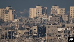 Destroyed buildings stand in the Gaza Strip, as seen from southern Israel, Nov. 16, 2023.
