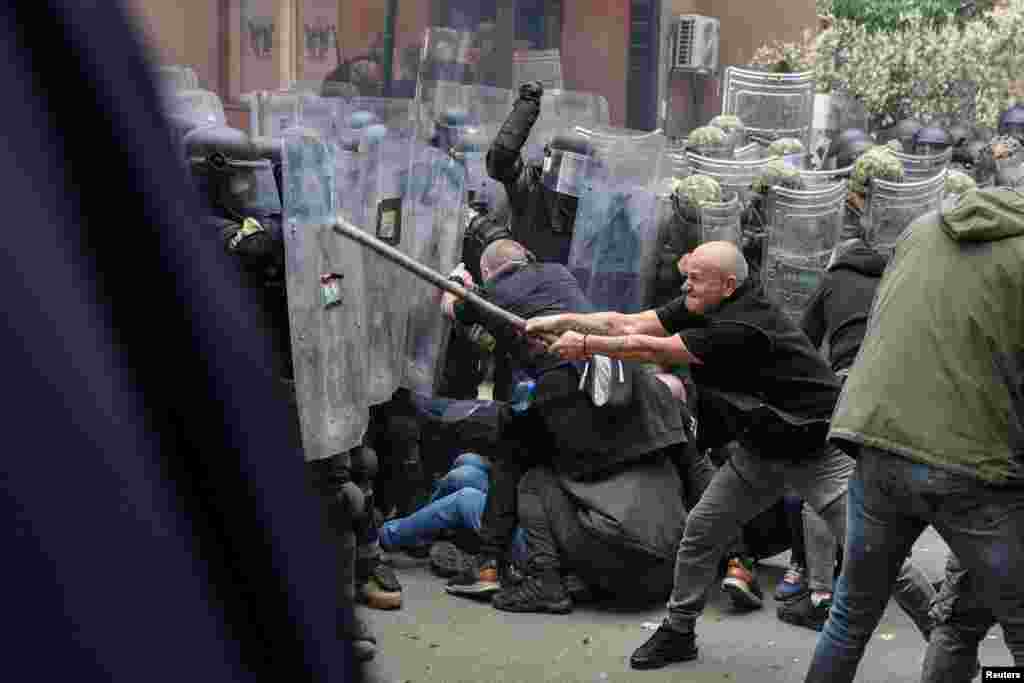 NATO Kosovo Force (KFOR) soldiers clash with local Kosovo Serb protesters at the entrance of the municipality office, in the town of Zvecan, Kosovo, May 29, 2023. 