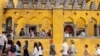 Tourists queue to visit the interior of the 19th century Pena Palace in Sintra, Portugal, Aug. 14, 2024.