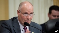 FILE - Rep. John Moolenaar of Michigan questions witnesses during a hearing on Capitol Hill, Feb. 28, 2023, in Washington. 