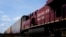 FILE - Canadian Pacific trains sit at the main CP Rail train yard in Toronto, March 21, 2022.